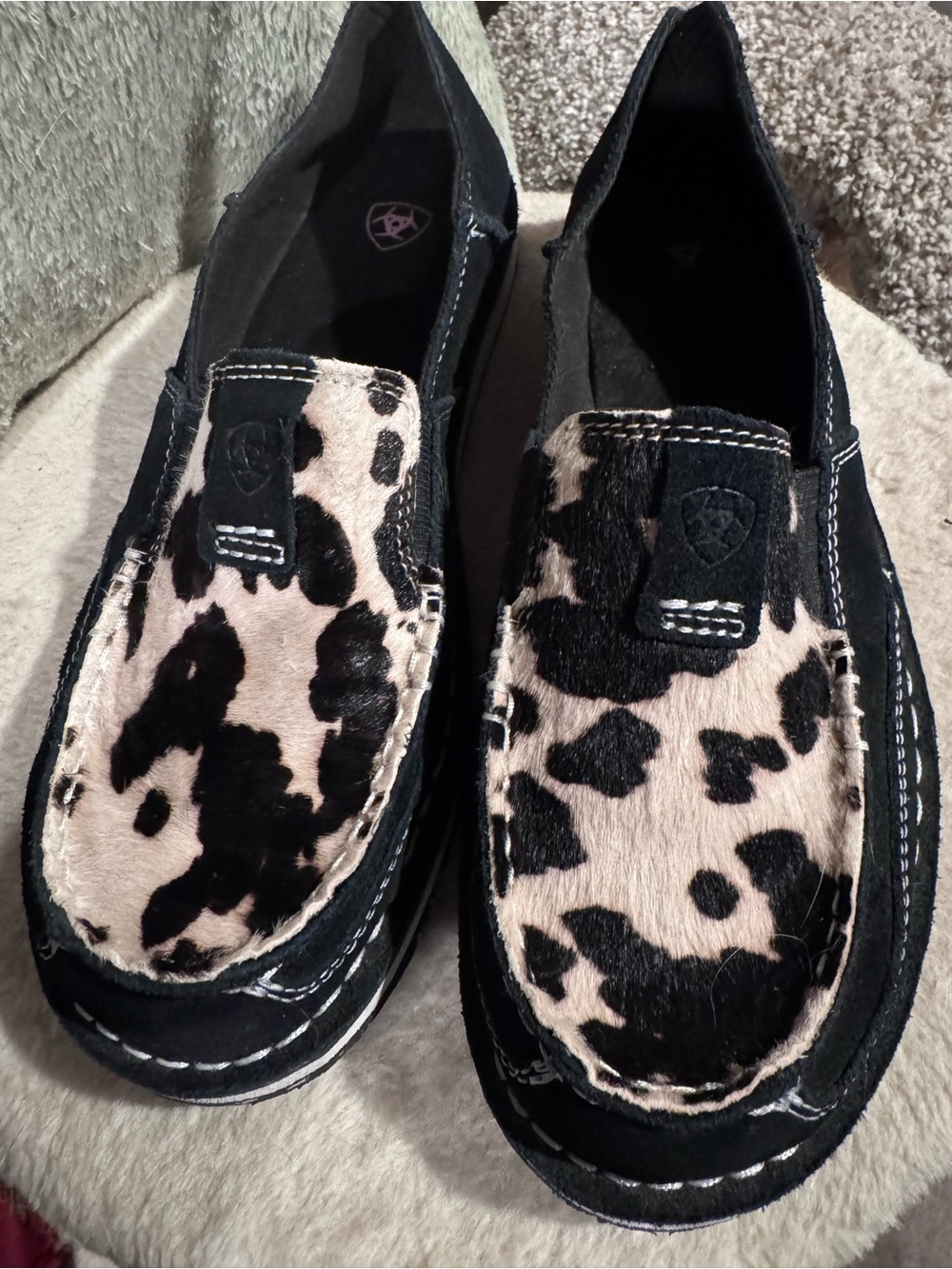Ariat Black and White Cow-Print Slip-Ons